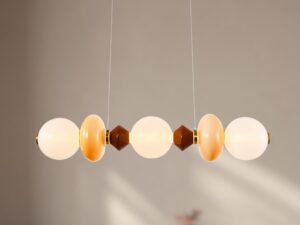 Miniaturka 1 - Lampa Kamesina LED z trzema świecącymi kulami – detal nad sofą