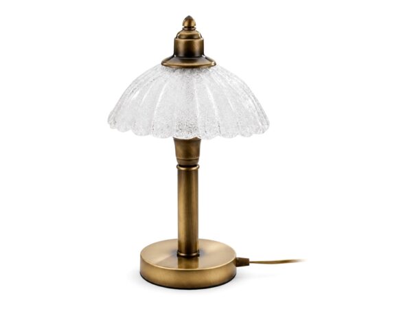Lampa stołowa Carmen z falowanym kloszem, mosiądz patynowany na białym tle