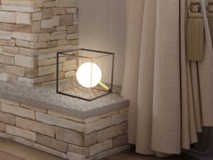 Miniaturka 1 - Lampa stołowa Nevemio świecąca na kamiennej półce we wnętrzu