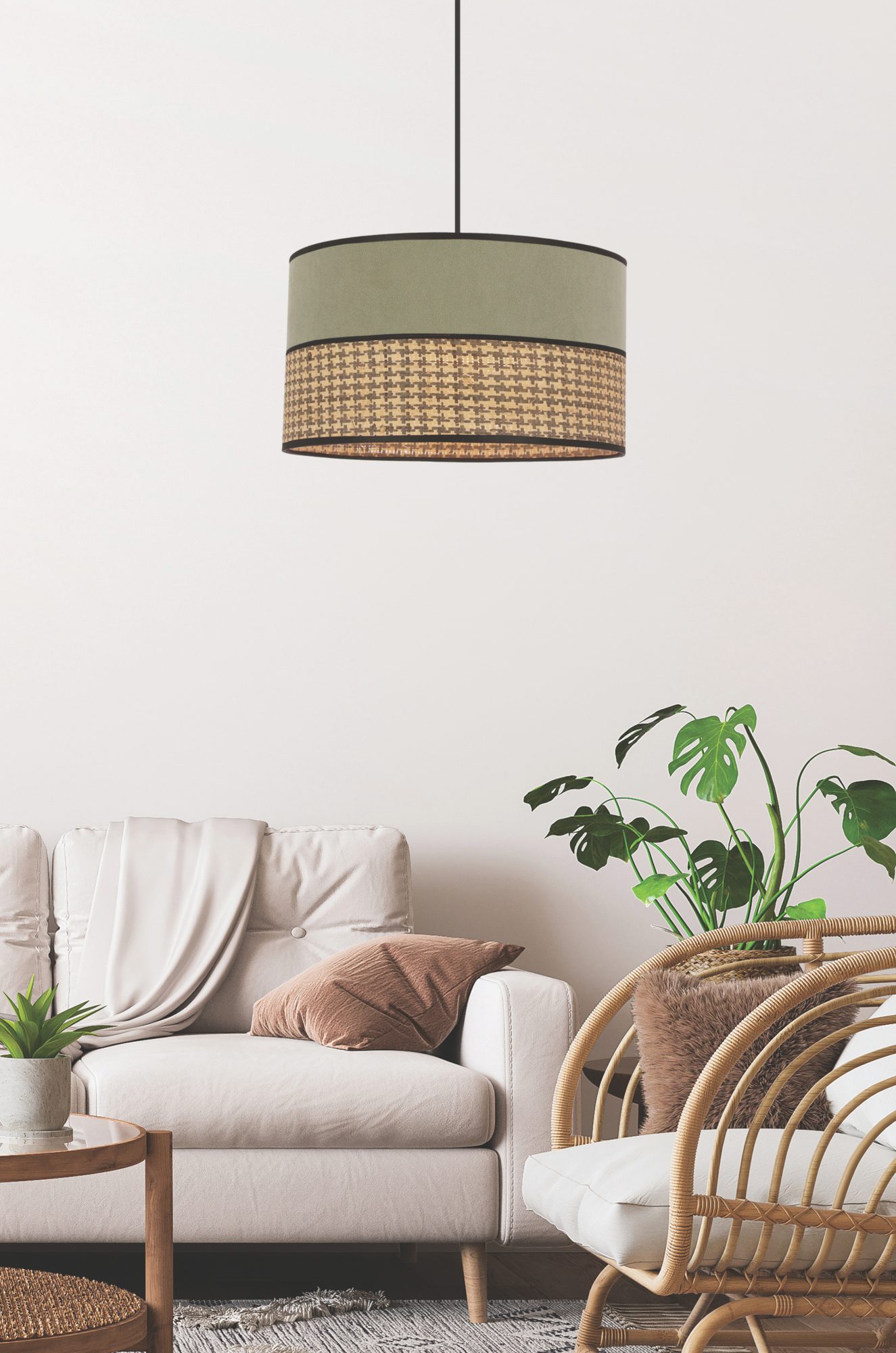 Lampa wisząca Aritia z abażurem dwukolorowym nad sofą w salonie