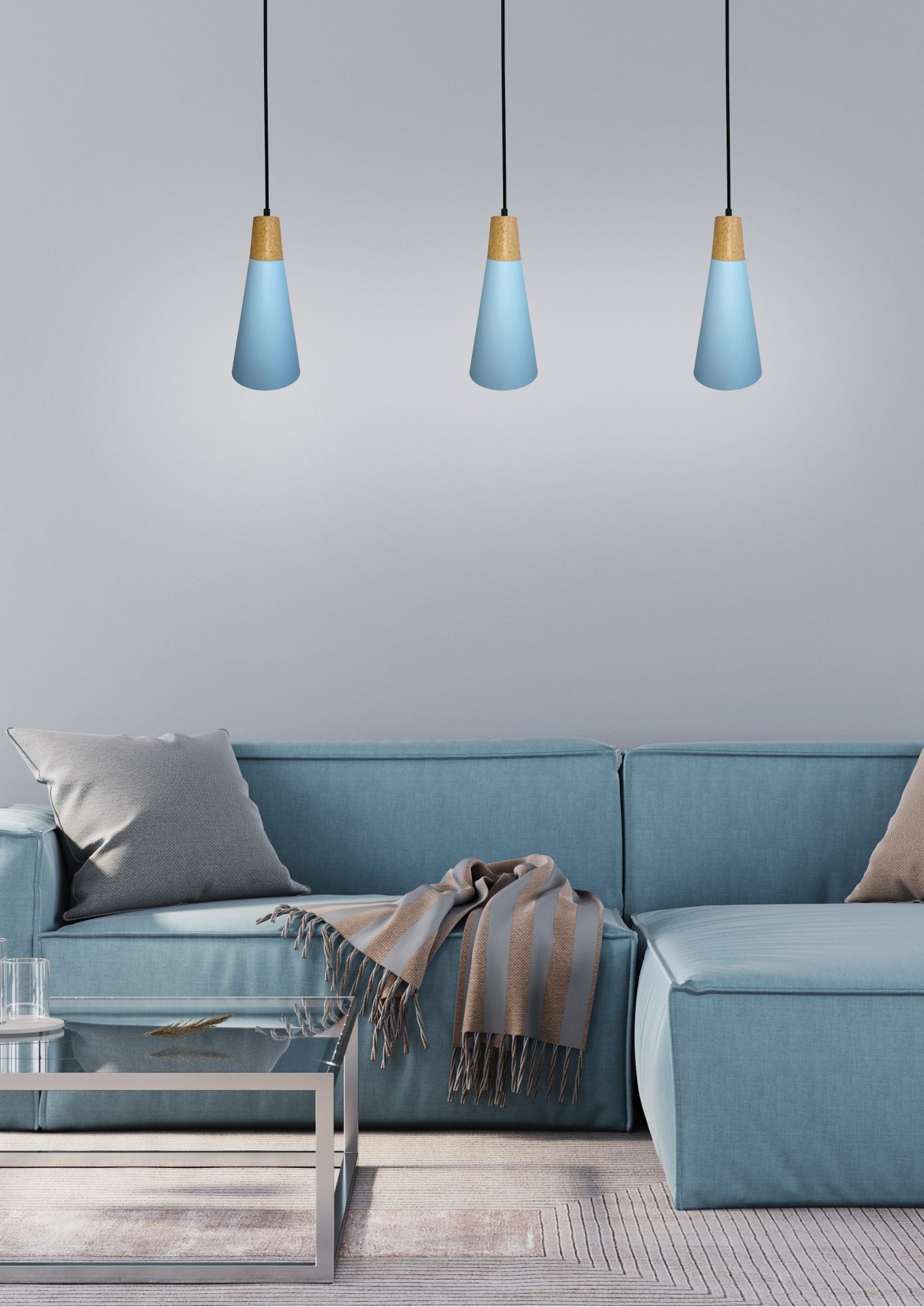 Trzy lampy wiszące Emadio z niebieskimi kloszami nad kanapą w salonie