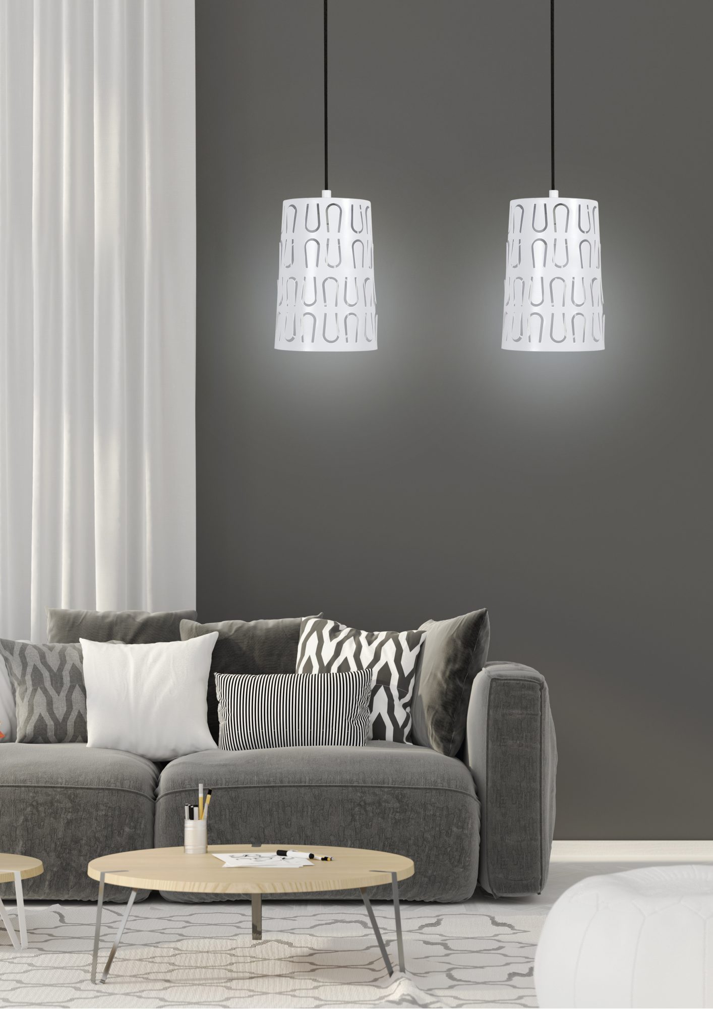 Biała dwupunktowa lampa wisząca Evodora w aranżacji nad szarym narożnikiem