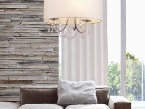 Miniaturka 1 - Lampa Gorometa beżowa w aranżacji salonu nad szarą sofą z dekoracyjnymi zawieszkami