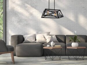 Miniaturka 1 - Czarna lampa wisząca Ilvotia nad szarą sofą w salonie z jasną ścianą