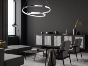 Miniaturka 13 - Chromowana lampa Nalitia nad strefą wypoczynku w ciemnym wnętrzu