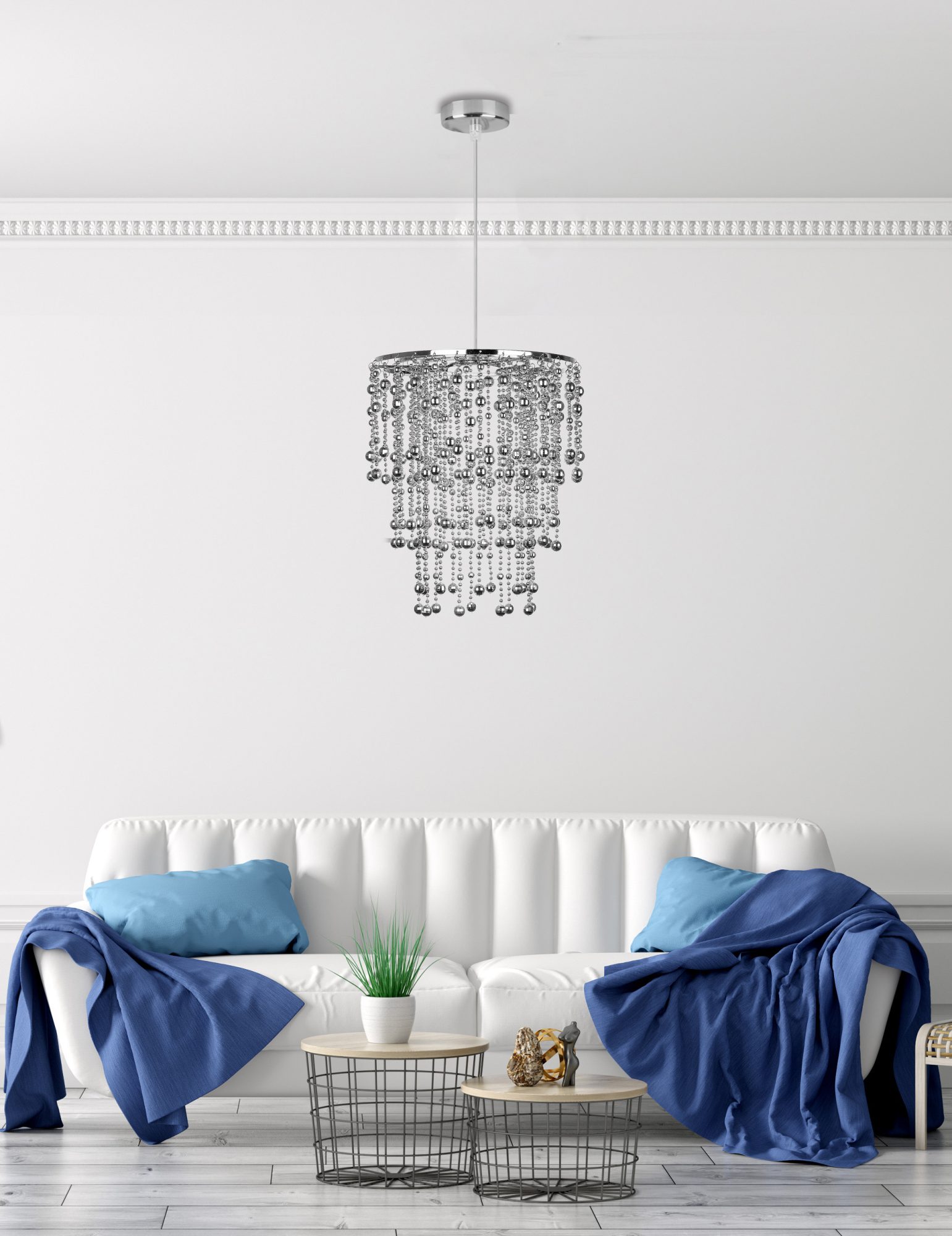 Lampa wisząca Narano z koralikami nad białą sofą w salonie