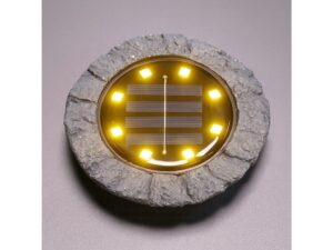 Miniaturka 1 - Kamienna lampka solarna LED świecąca ciepłym światłem na szarym tle