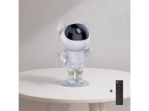 Miniaturka 1 - Projektor gwiazd Maretora stojący na stoliku obok pilota zdalnego sterowania