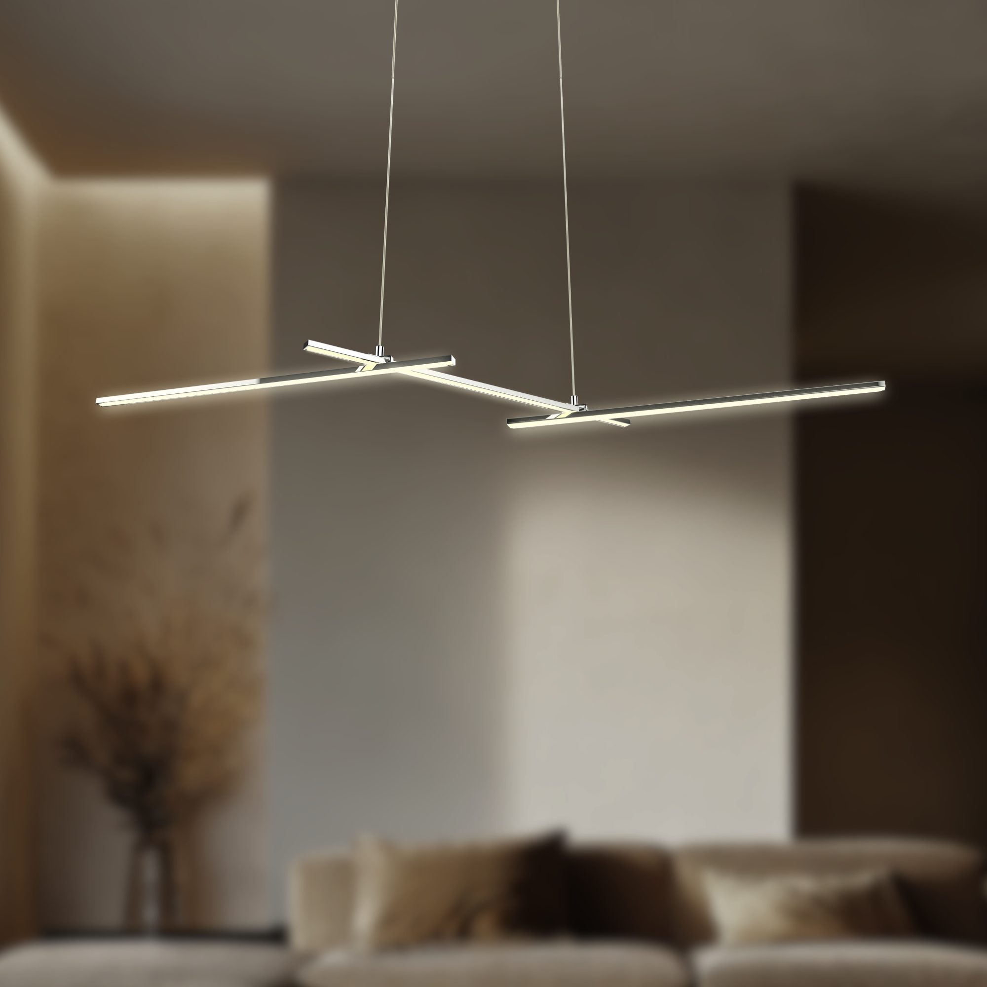 Chromowane liniowe ramiona lampy Seleda LED świecą w salonie