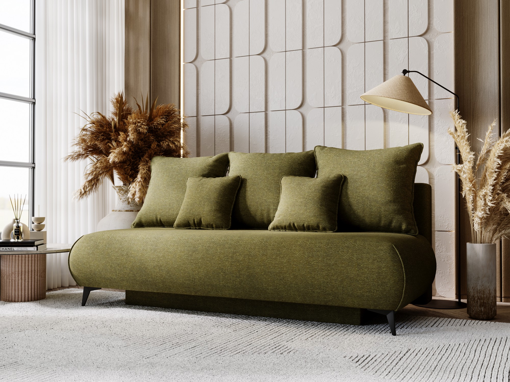 Sofa rozkładana Modrino w zielonej tkaninie ustawiona w aranżacji przytulnego salonu